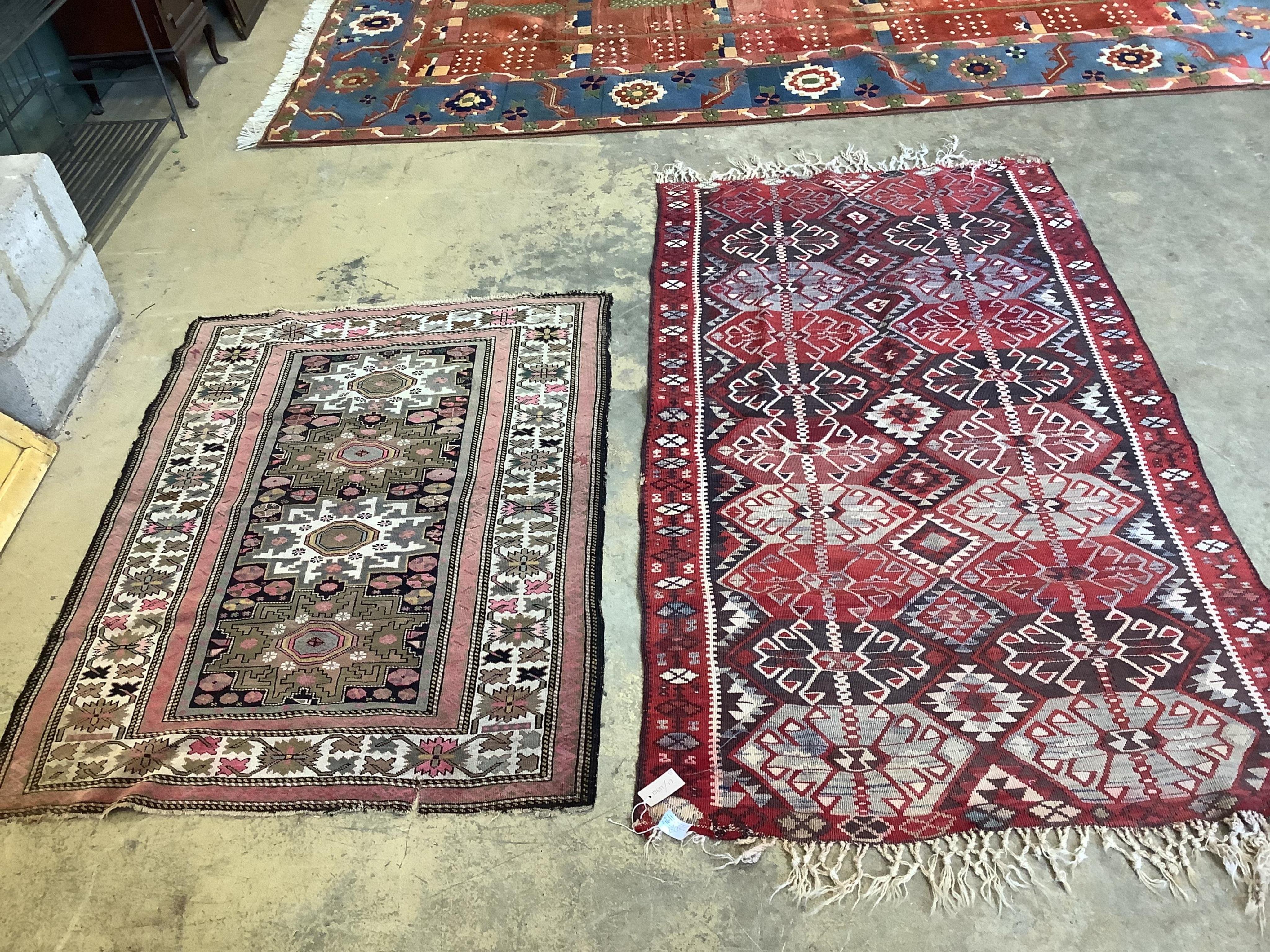 A Kelim rug and a Persian black ground rug, 190 x 105cm and 140 x 102cm. Condition - fair to good